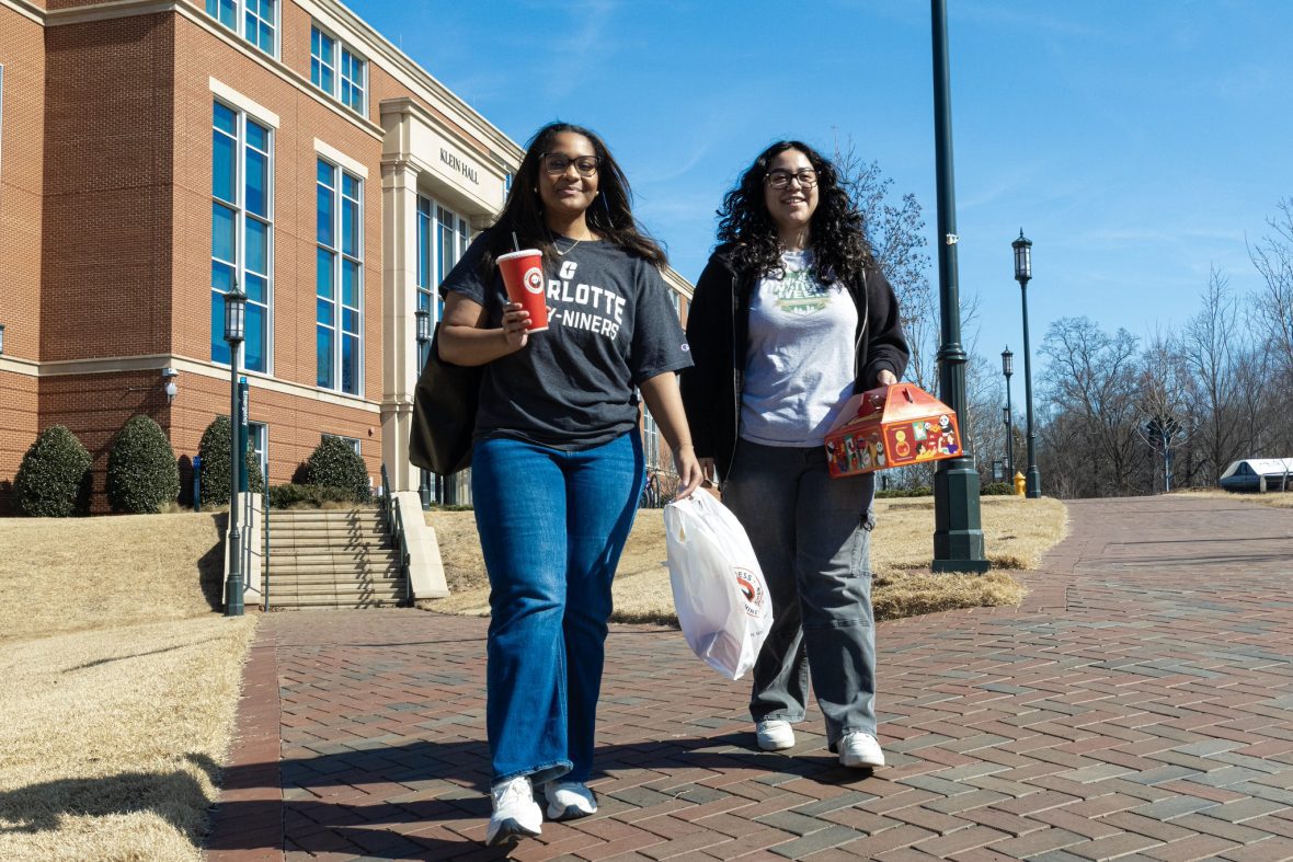 Students walking outside with food