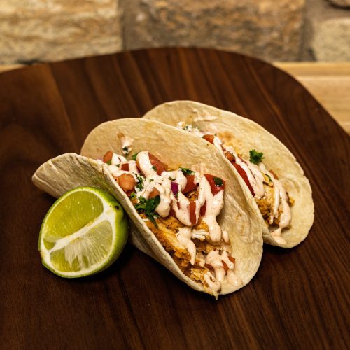 flour tacos on table with a lime