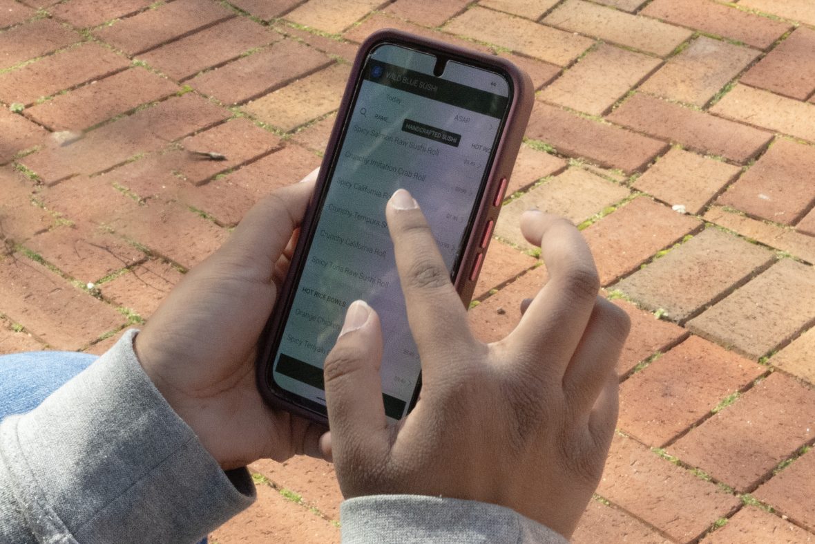 Hands on phone using mobile order app